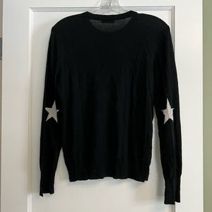 Equipment black crew neck sweater with white stars on sleeves